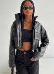 Cropped jacket Faux leather material High neck Zip & press button fastening Twin chest pockets Single button cuff
