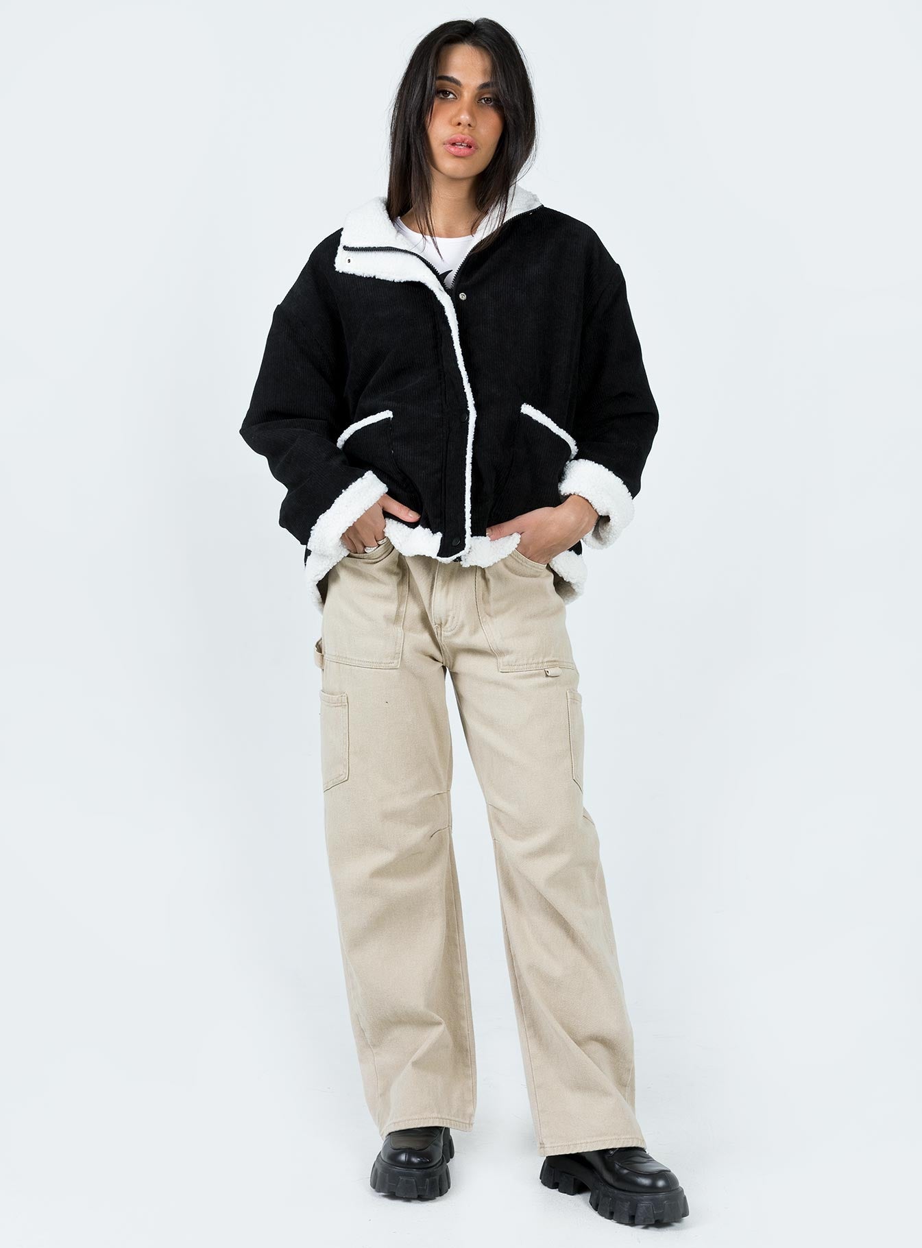 Jacket Corduroy material Faux fur lining & trim High neck Zip & button fastening at front Twin hip pocket