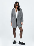 Oversized coat Houndstooth print Soft knit material Double button fastening Twin hip pockets Longline design Fully lined