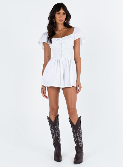 White romper Elasticated shoulders & neckline  Tie at bust  Shirred waist  Twin hip pockets  Fully lined 
