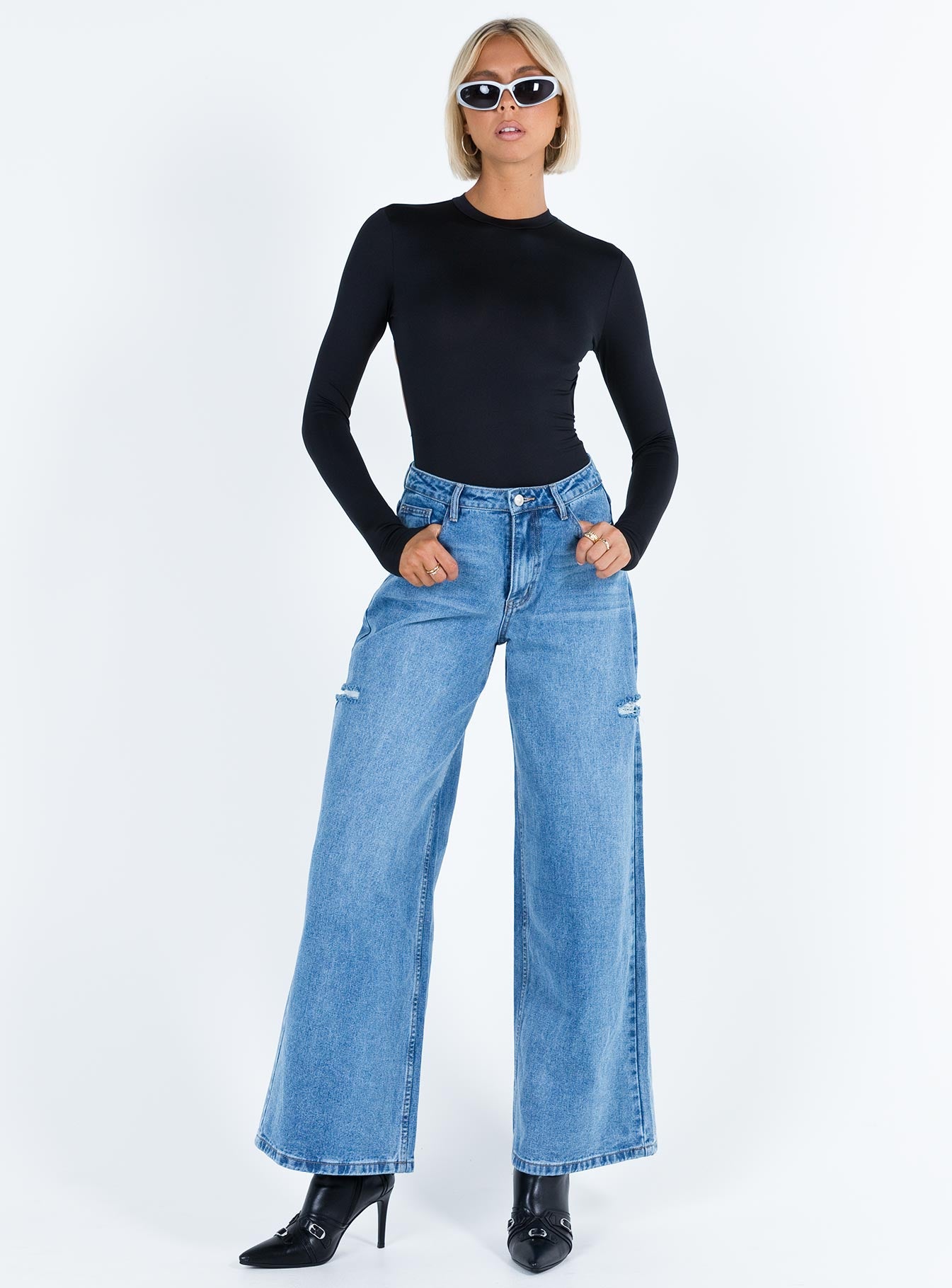 front view of model wearing Princess Polly Tarrick High Neck Bodysuit Black Full Sleeves High Neck 