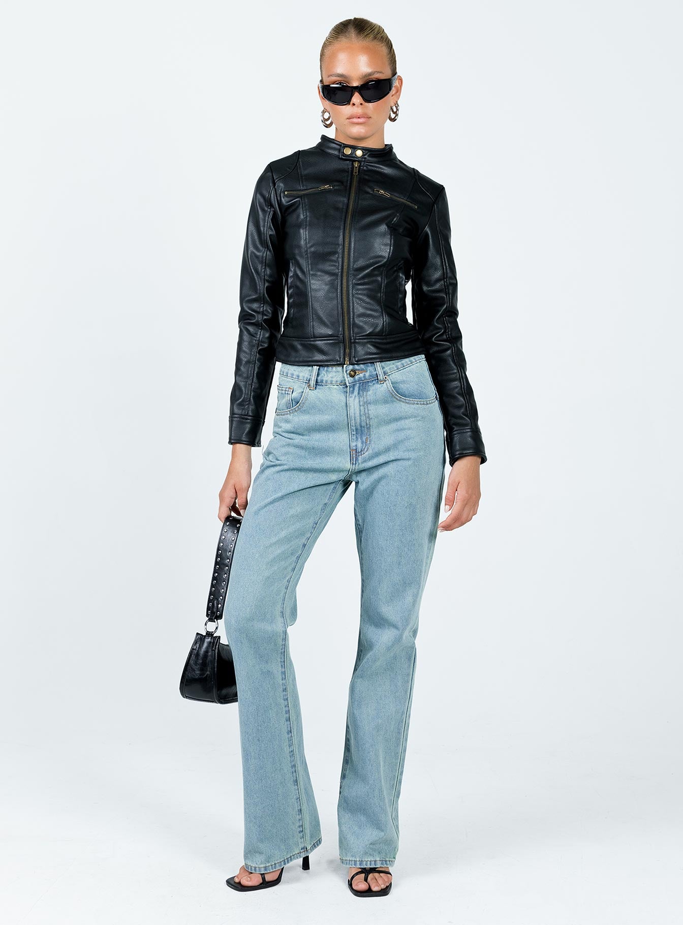 Leather jacket Faux leather material Gold-toned hardware High neck Zip fastening at front