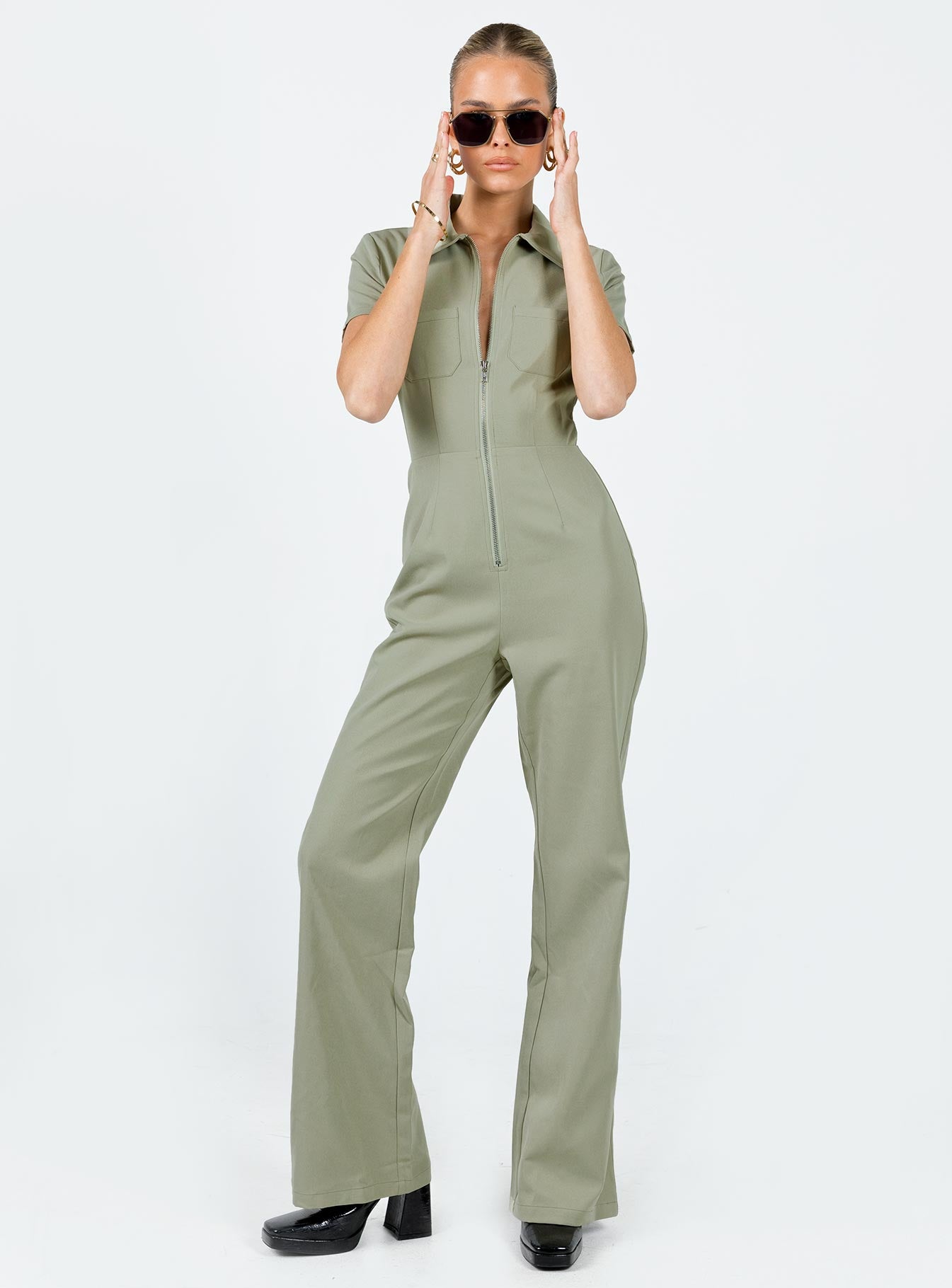 Jumpsuit Classic collar Zip fastening at front Twin chest pockets Straight leg