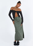 Black top Off the shoulder design Inner silicone strip at bust Split hem Good stretch Partially lined