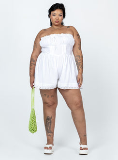 Strapless romper Lace details Ruffle neckline  Adjustable tie at neckline  Shirred back  Twin hip pockets  Non-stretch