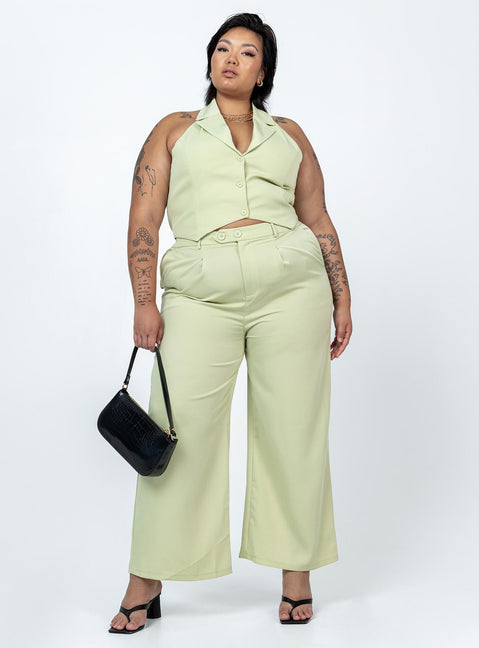 Matching set High waisted pants  Zip & button fastening  Elasticated back band  Belt looped waist  Twin hip pockets Wide leg  Vest top  Lapel collar  Button front fastening 