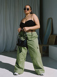 Front view of model wearing  front Princess Polly High Waisted Pants  Snatched Mid Rise Cargo Pants Green Curve