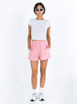 front view of model wearing Princess Polly Mateo Shorts Pink mid-rise 