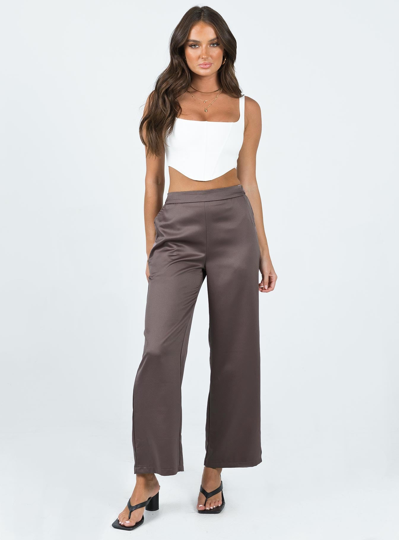Front view of model wearing  front Princess Polly High Waisted Pants  Rainford Pants Mocha