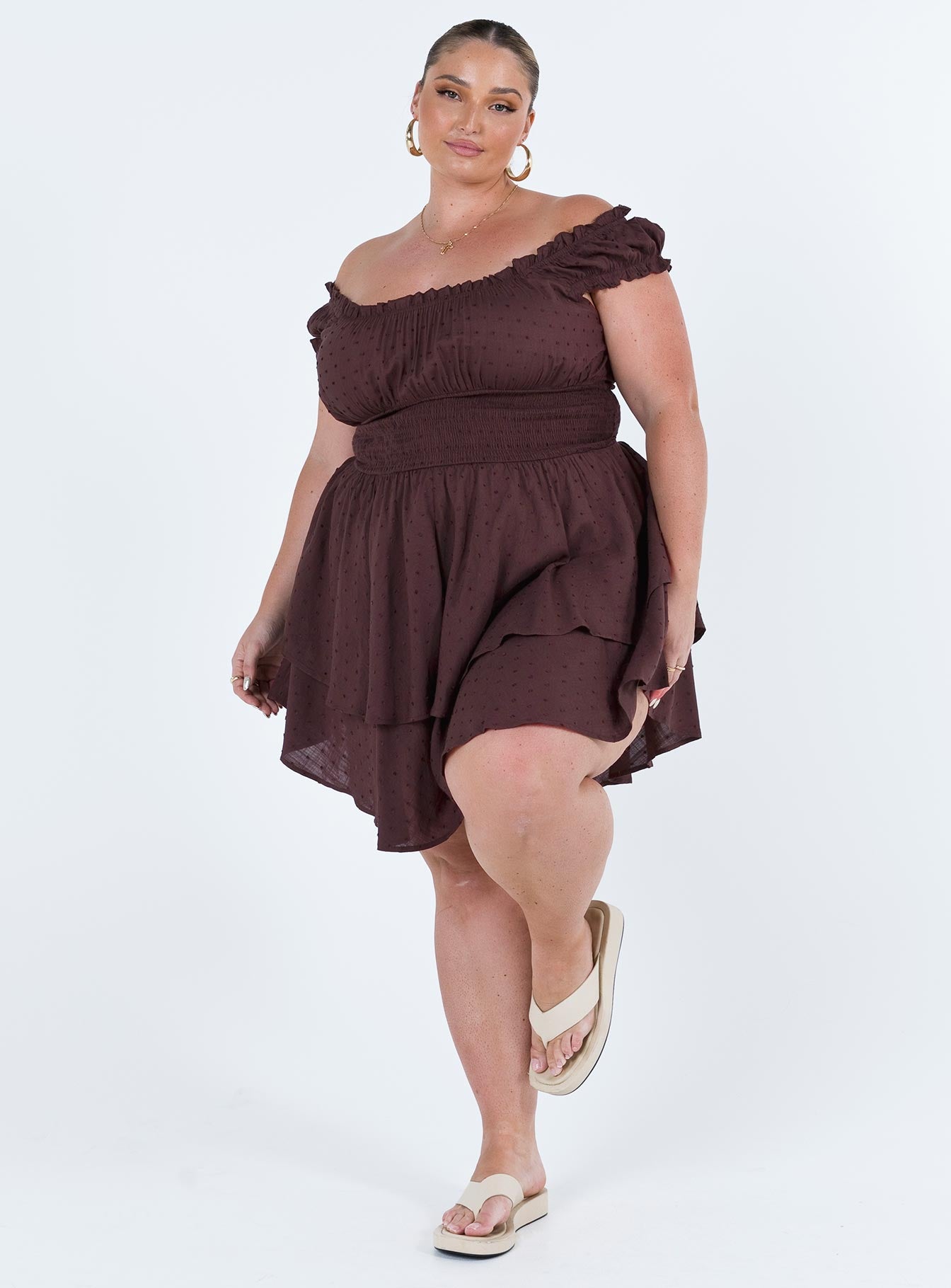 Brown romper Soft textured material Shirred waistband Elasticated neck and sleeves Can be worn on or off shoulder Layered ruffle hem Good stretch Fully lined