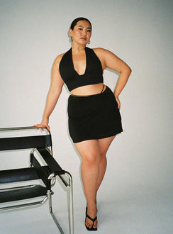 side view of model wearing Princess Polly Jordy Top Black Curve Eco Sleeveless Plunger 