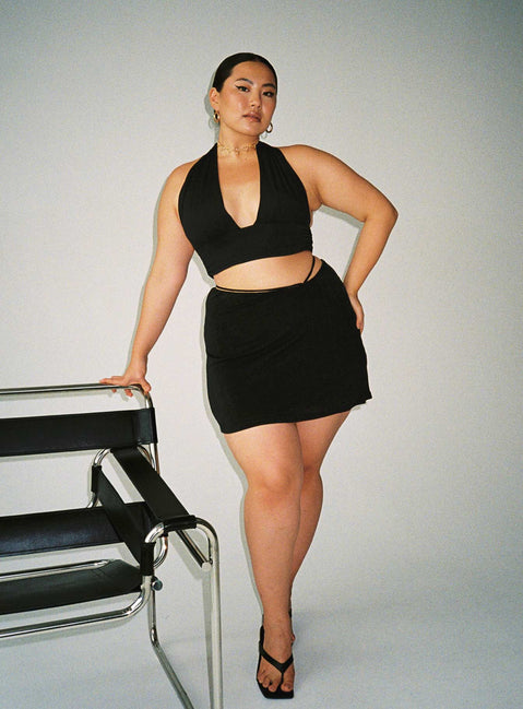 side view of model wearing Princess Polly Jordy Top Black Curve Eco Sleeveless Plunger 