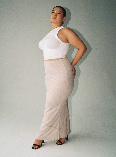   side view of model wearing Princess Polly Oscar Maxi Skirt Beige Curve Maxi 