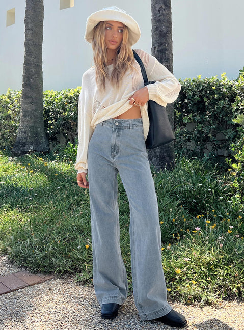 Front view of model wearing  front Princess Polly Low Rise Jeans  Tari Wide Leg Jeans Light Wash Denim
