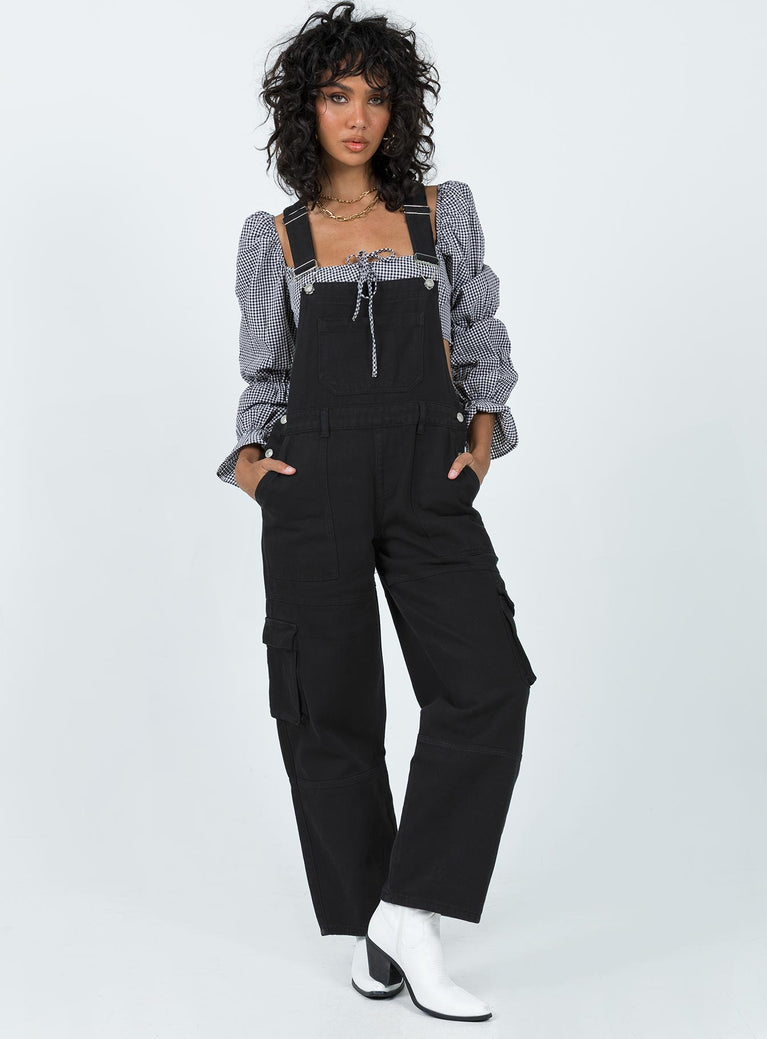 Overalls Denim material Adjustable shoulder straps  Chest pocket  Belt looped waist  Invisible zip fastening at side Four-pocket design  Cargo style leg pockets Wide leg