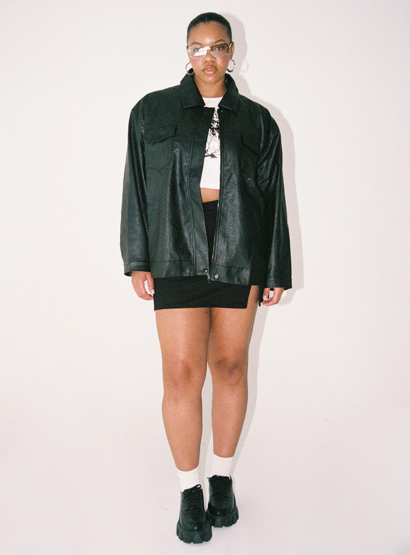 Jacket Faux leather material Zip front fastening Pointed collar Twin chest & hip pockets Single button cuff