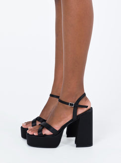 Platform heels Strappy upper Platform base Buckle fastening at ankle Rounded toe Block heel