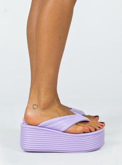 Sandals 100% polyurethane Faux leather material Flip-flop style upper  Exaggerated platform base  Rounded toe  Padded footbed  Heel height: 7cm / 2.7" 