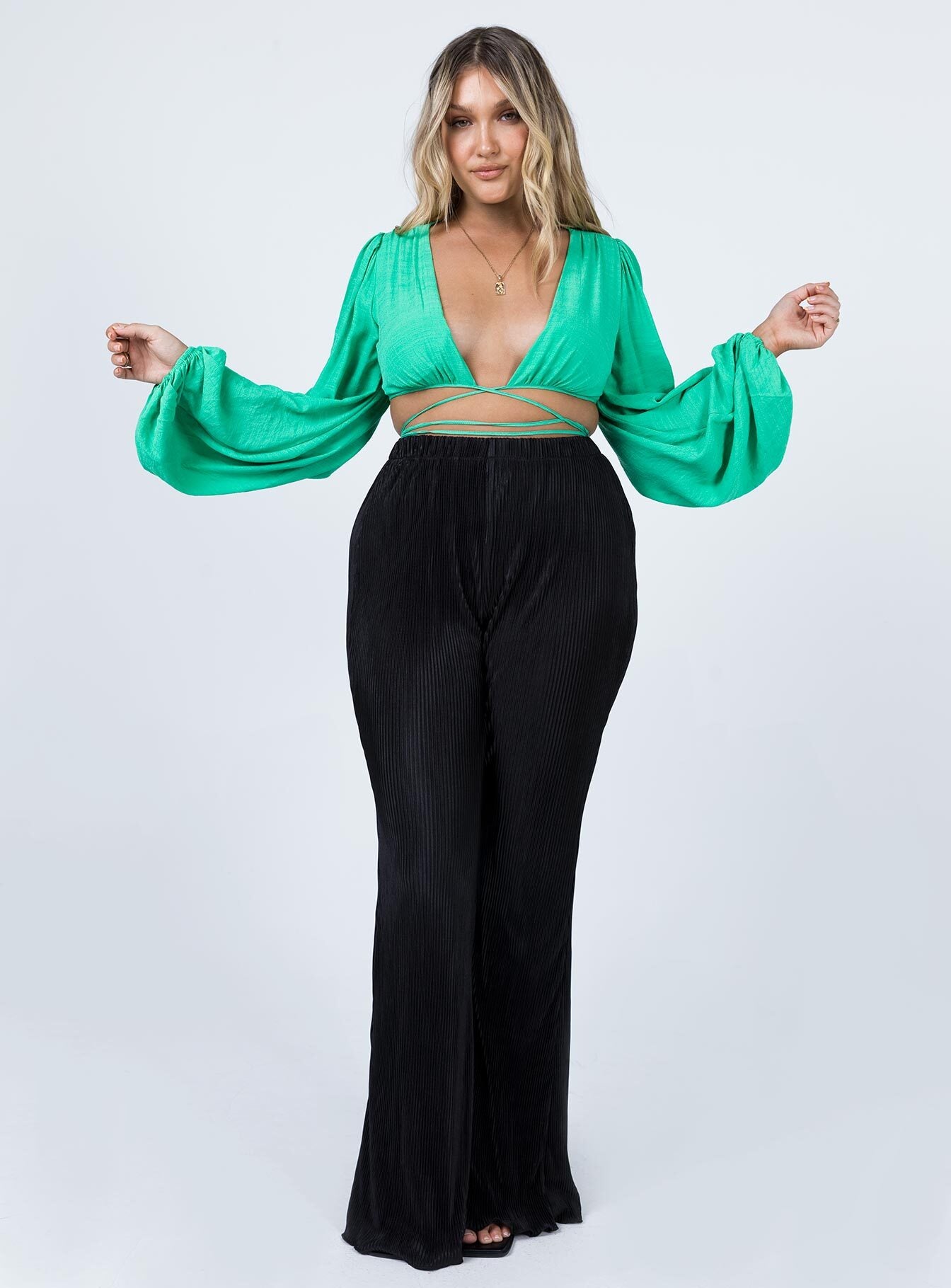 side view of model wearing Princess Polly Ayesha Long Sleeve Top Green 