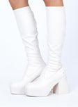 Boots  Faux leather material  Fitted at leg  Block heel Platform base  Square toe  Good stretch 