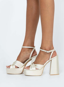 Heels Strappy ankle fastening  Fabric upper  Block heel  Platform base  Padded footbed 