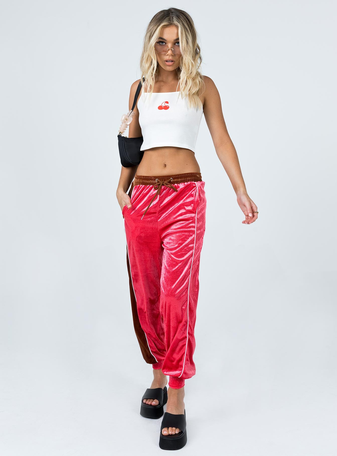 front view of model wearing Princess Polly Harper Velour Track Pants Pink 