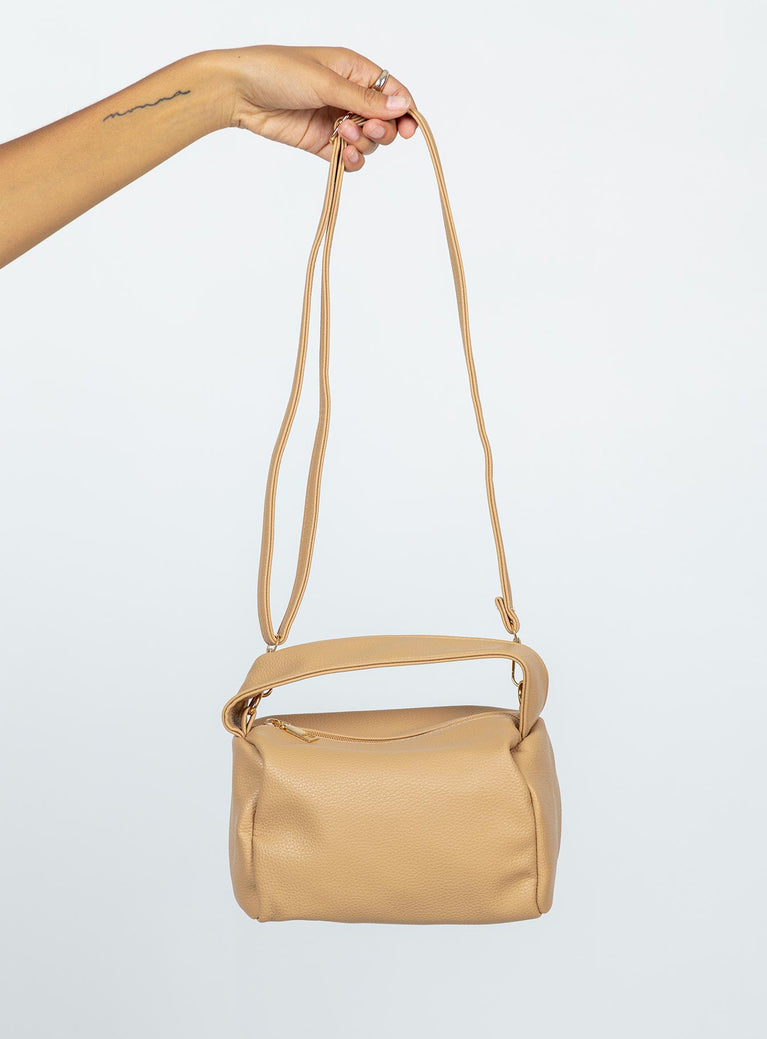 Bag Faux leather material Adjustable & removable shoulder strap Fixed handle Zip fastening Gold tones hardware Flat base