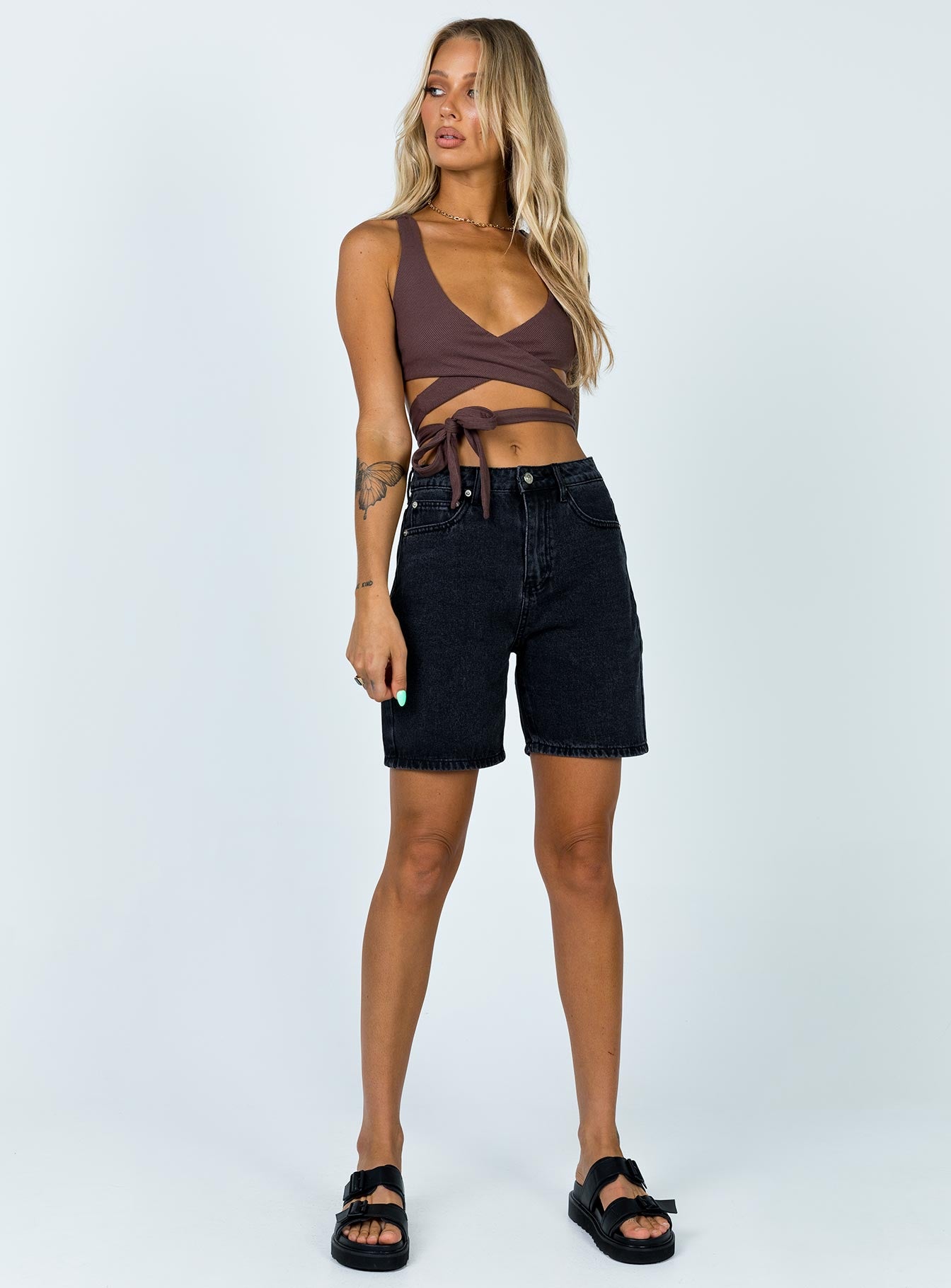 side view of model wearing Princess Polly Jaye Top Brown 