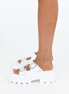 Sandals Faux leather material Platform base Square toe Double strap upper Silver toned buckles Padded footbed Treaded sole