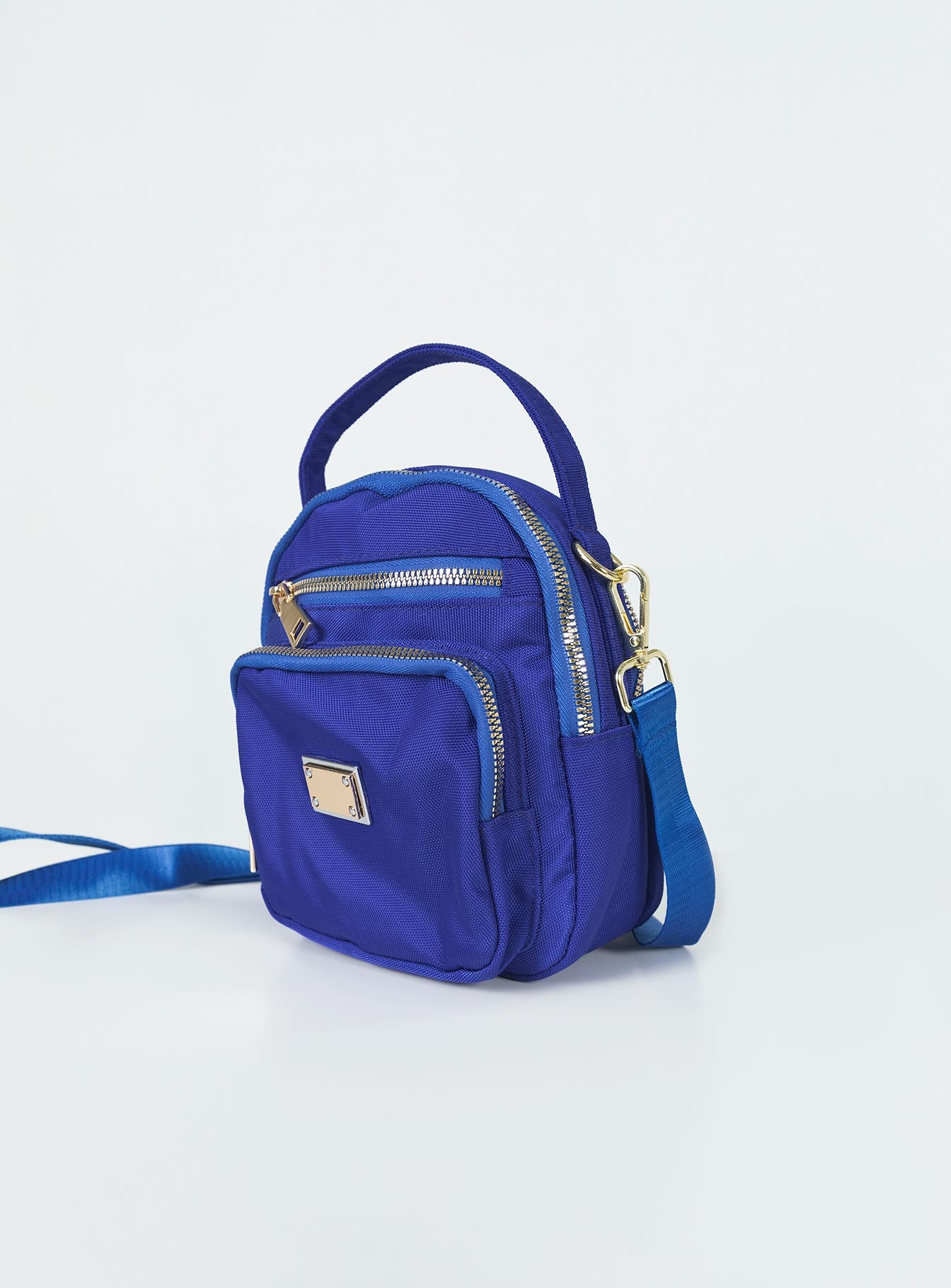 Crossbody bag  Princess Polly Exclusive 80% nylon 20% polyester Nylon material  Single handle Adjustable & removable crossbody strap  Four seperate compartments Gold-toned zip fastenings 