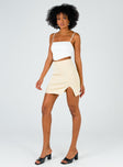   side view of model wearing Princess Polly The Lola Mini Skirt Ecru 