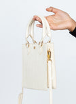 Beige bag Faux leather material  Croc print  Twin handles  Removable & adjustable shoulder strap  Internal card slip  Magnetic b