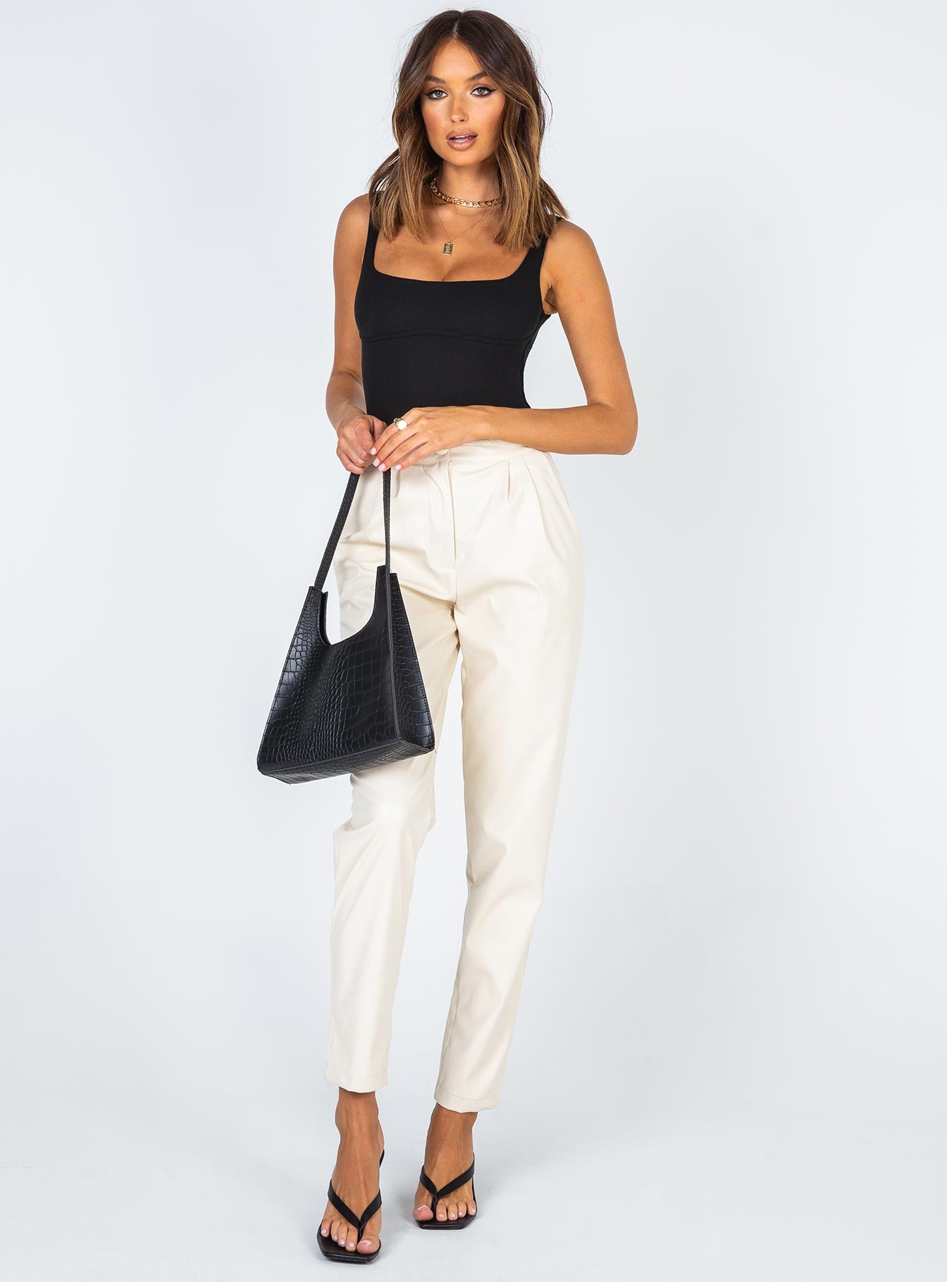 front view of model wearing Princess Polly Crosby Bodysuit Black Sleeveless 