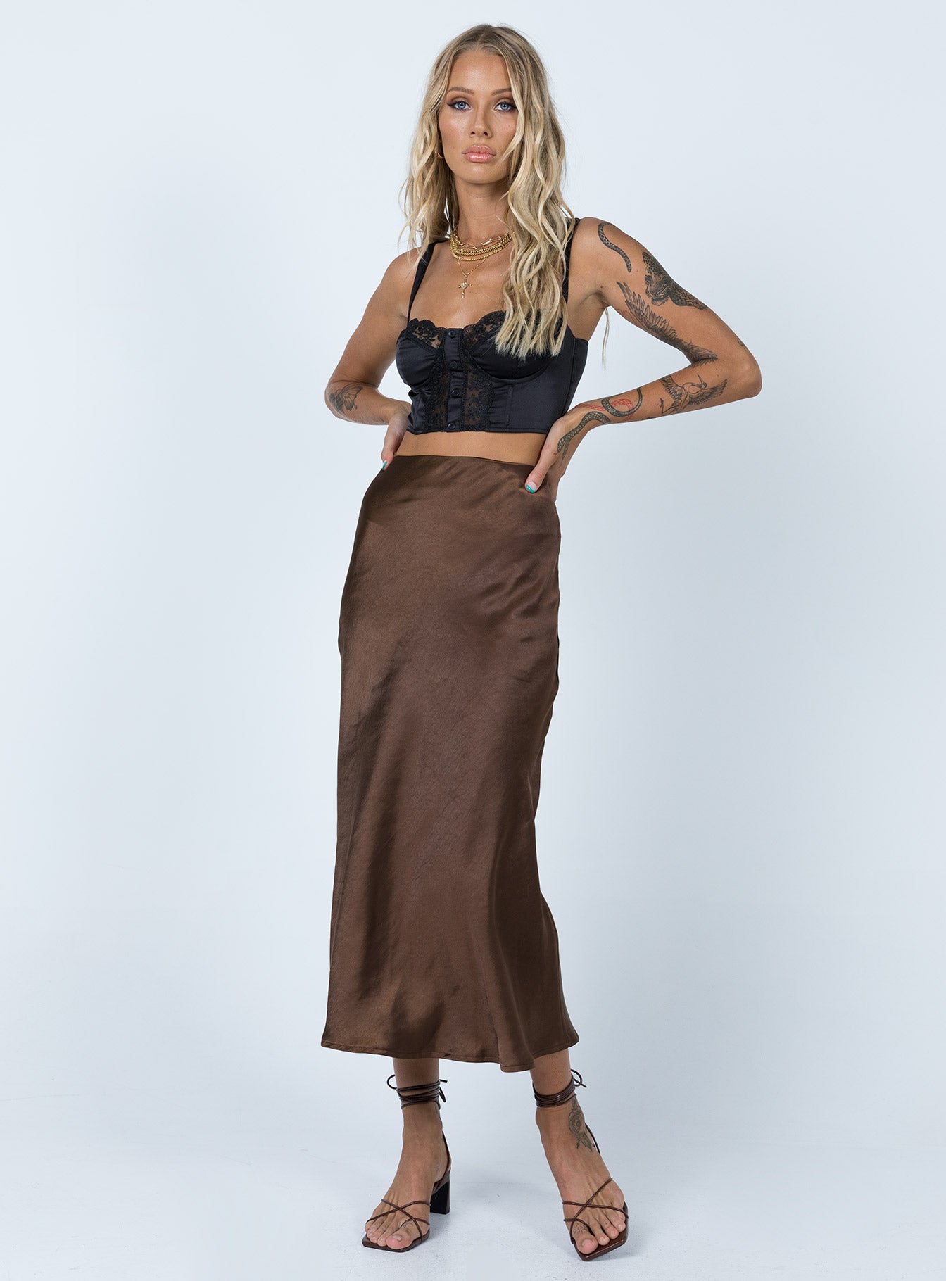   front view of model wearing Princess Polly Tyra Satin Midi Skirt Brown 