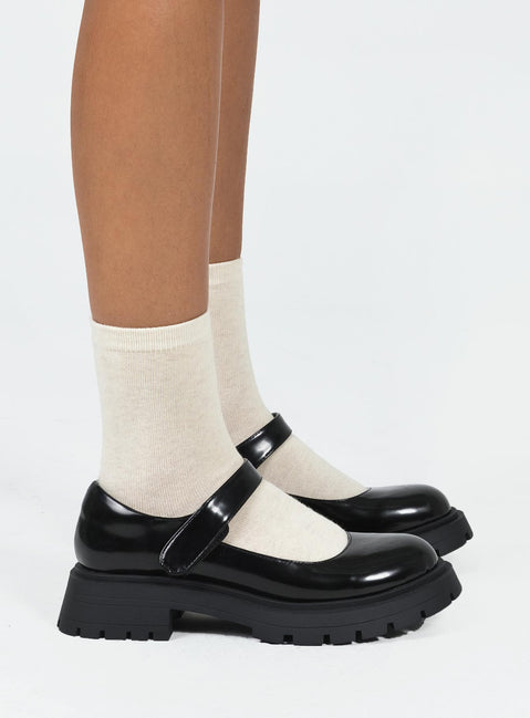 Loafers Faux patent leather Platform base Velcro fastening strap Rounded toe Treaded sole Padded footbed