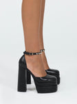 Platform heels Faux leather material  Closed toe  Block heel  Ankle buckle fastening  Platform base 