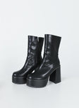 Boots Faux leather material  Mid-calf length  Zip fastening at side  Rounded toe Platform base  Block heel  Treaded sole