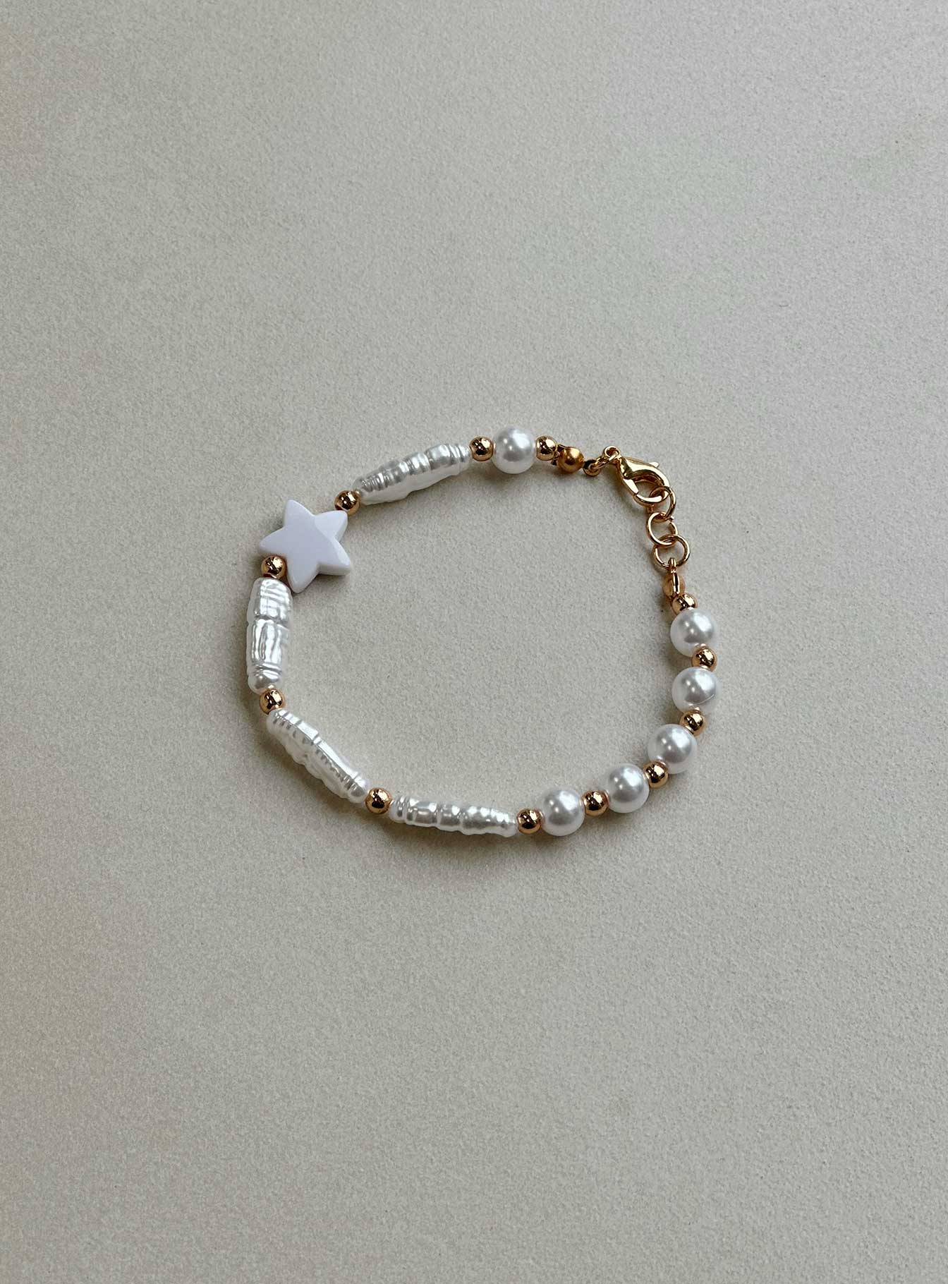 Bracelet Gold toned Faux pearl detail Lobster clasp fastening