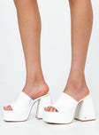 Platform heels Faux leather material  Single wide upper  Block heel  Square toe  Padded footbed 