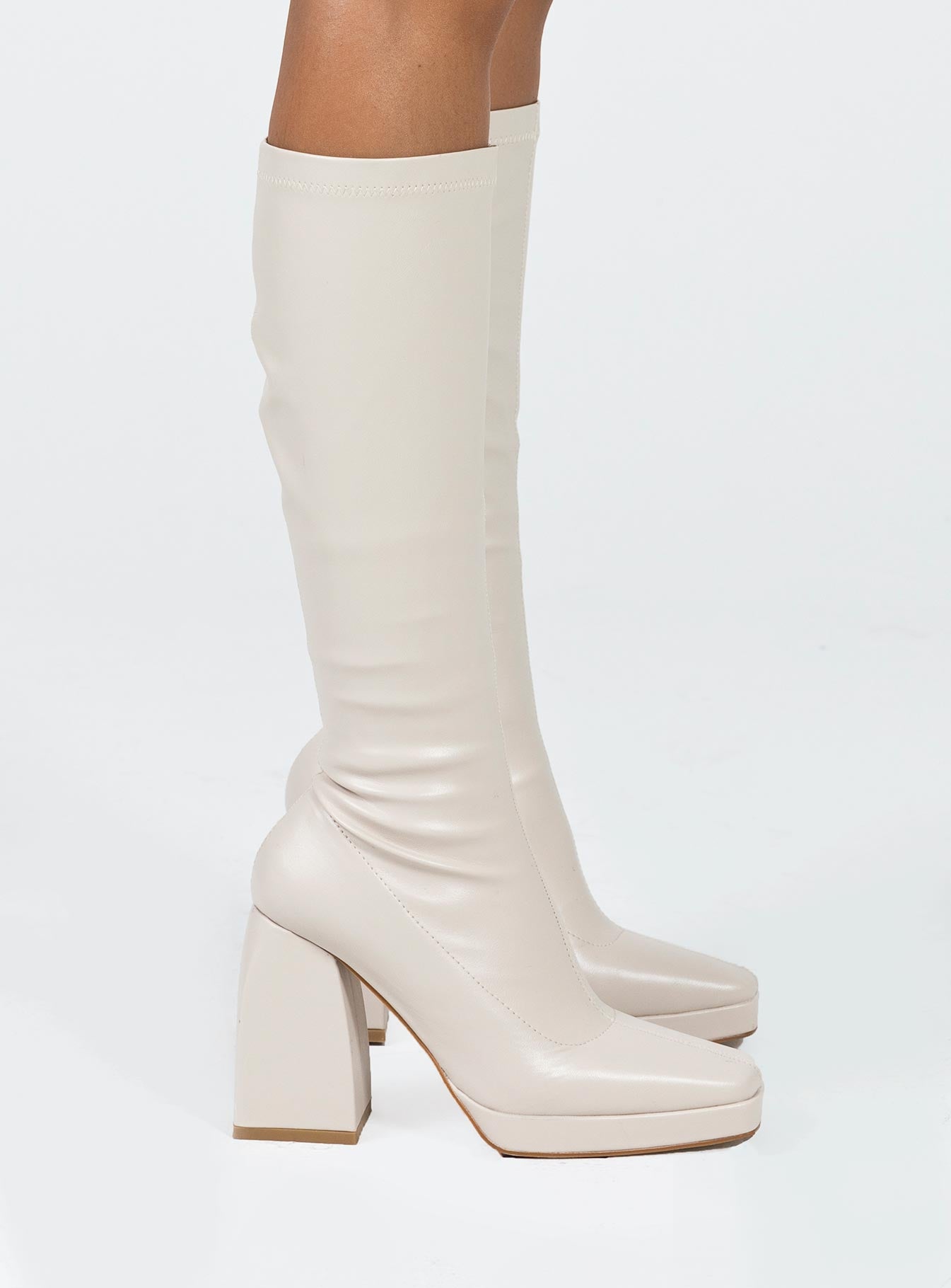 Knee-high boots Faux leather material Square toe Platform base Block heel Zip fastening at side Padded footbed