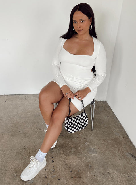side view of model wearing Princess Polly Nolan Mini Dress White Curve 