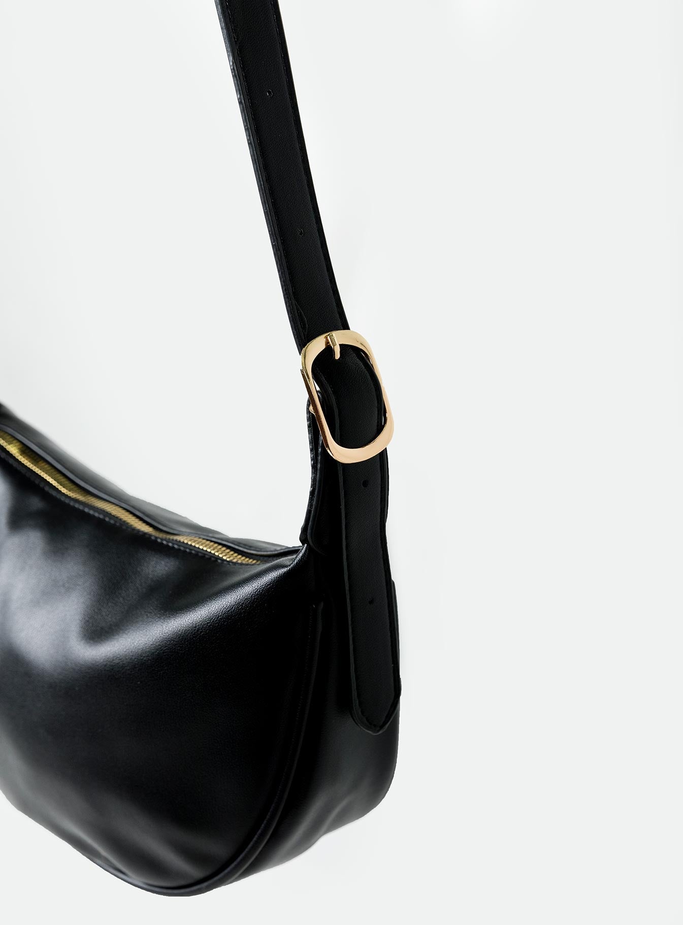 Crossbody bag Faux leather material Adjustable & removable crossbody strap Gold-toned hardware Zip fastening Internal zip pocket Flat base