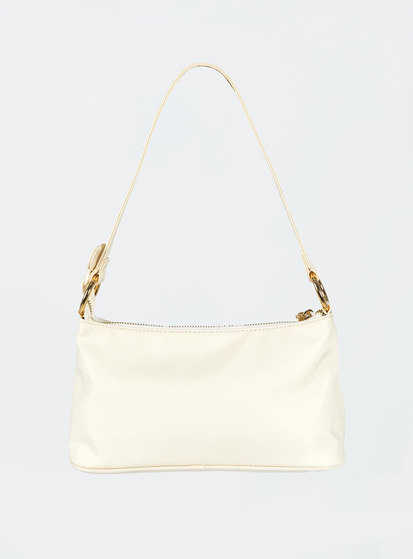Shoulder bag Fixed strap Gold-toned hardware Zip fastening Two internal pockets Flat base