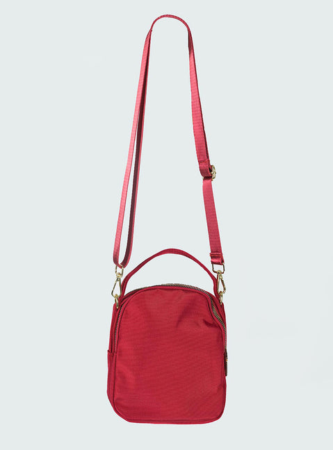 Crossbody bag Nylon material  Single handle  Four seperate compartments Gold-toned hardware Zip fastening Adjustable & removable crossbody strap 