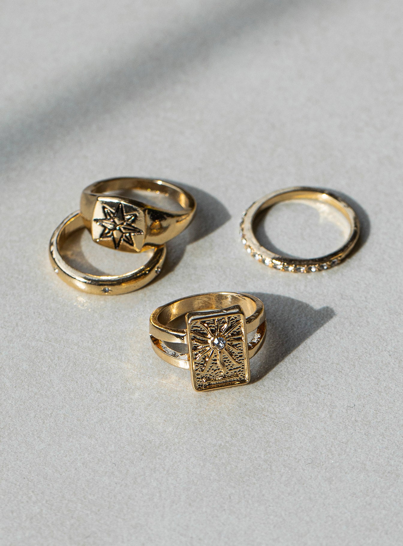 Gold Rings Pack of four  Two signet styles  Two slim bands  Gold-toned 