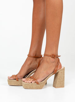 Heels Woven base  Faux leather upper  Single toe strap  Ankle strap  Buckle fastening  Platform base  Square toe  Block heel 