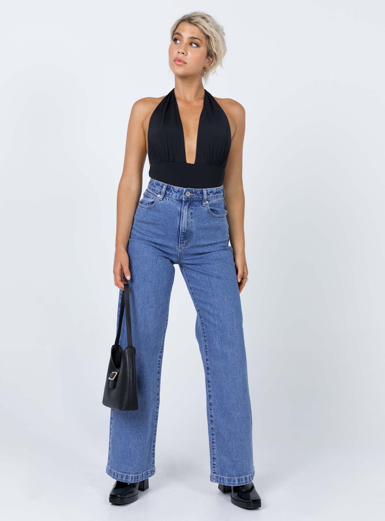 side view of model wearing Princess Polly Jordy Bodysuit Black Sleeveless Plunger 