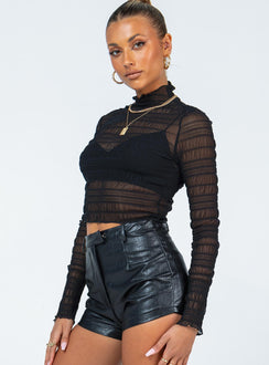 side view of model wearing Princess Polly Maddy Long Sleeve Top Black 