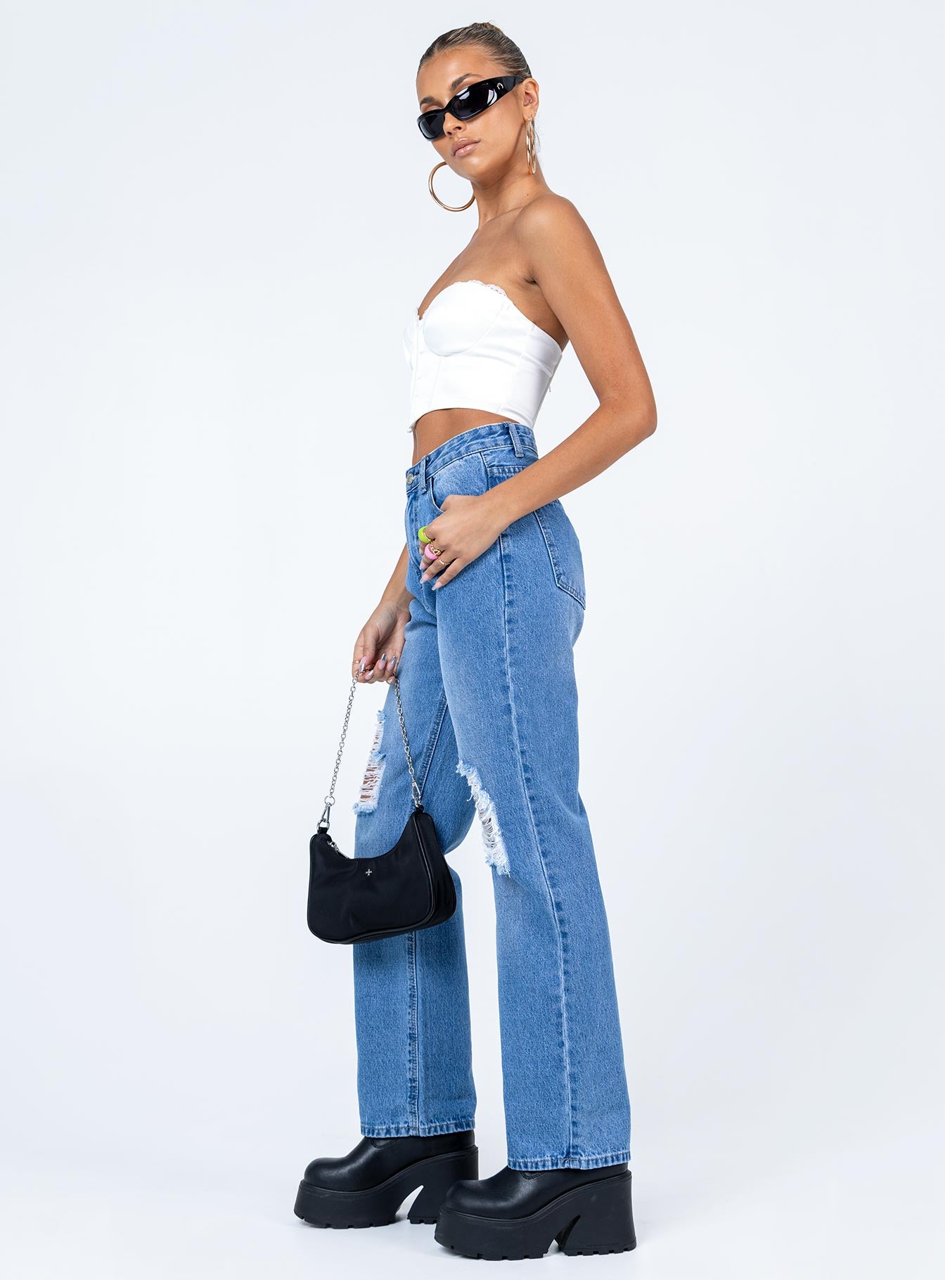 side view of model wearing Princess Polly Brighton Denim Jeans Mid Rise 