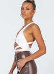 side view of model wearing Princess Polly Elon Bodysuit White Sleeveless V-Neck 